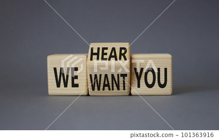 We hear and want You symbol. Tturned wooden cubes with words We want you and We hear you. Beautiful grey background. Business and We hear and want You concept. Copy space We hear and want You symbol. Tturned wooden cubes with words We want you and We hear you. Beautiful grey background. Business and We hear and want You concept. Copy space 101363916