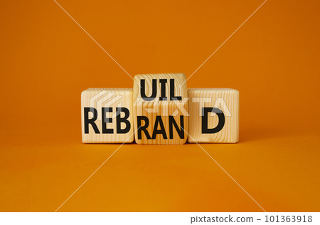 Rebuild and Rebrand symbol. Turned wooden cubes with words Rebrand and Rebuild. Beautiful orange background. Rebuild Rebrand and Business concept. Copy space Rebuild and Rebrand symbol. Turned wooden cubes with words Rebrand and Rebuild. Beautiful orange background. Rebuild Rebrand and Business concept. Copy space 101363918