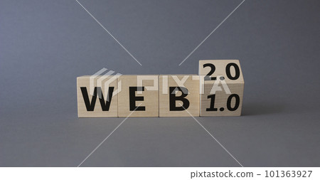WEB 2 or 1 symbol. Turned wooden cubes with words WEB 1.0 or WEB 2.0. Beautiful grey background. Business and WEB concept. Copy space WEB 2 or 1 symbol. Turned wooden cubes with words WEB 1.0 or WEB 2.0. Beautiful grey background. Business and WEB concept. Copy space 101363927
