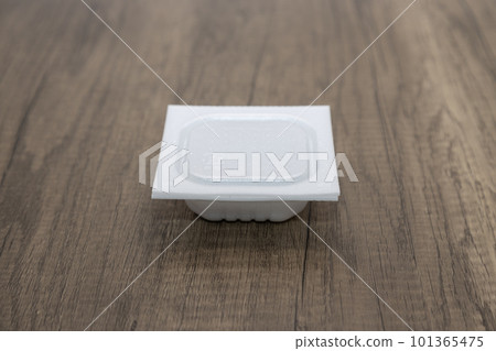 Natto with a closed lid on a wooden desk Natto with a closed lid on a wooden desk 101365475