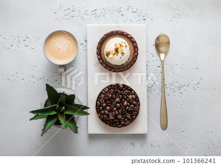 White marble board with chocolate caramel dessert and cup of coffee 101366241