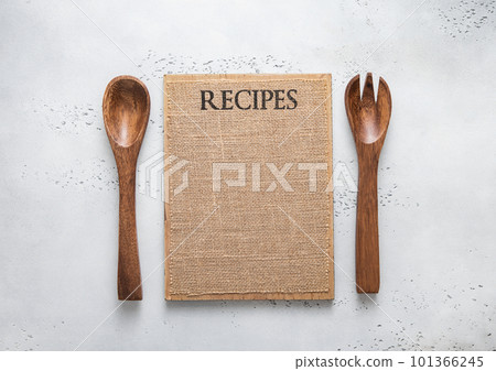 Menu board with wooden spoon and fork on light kitchen background. 101366245