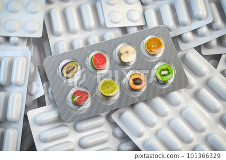 Multivitamins and dietary natural supplements for a healthy diet. Fruits in pills on blister pack. 101366329
