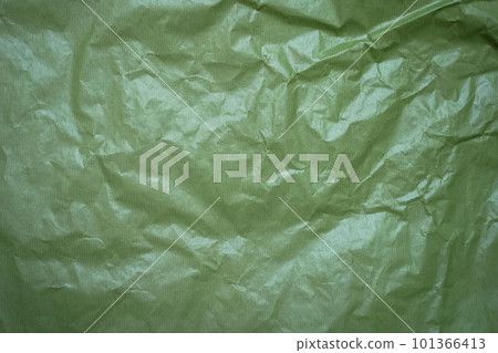 Plastic texture of a piece of crumpled green cellophane. Texture of green oilcloth. Water color, close-up 101366413