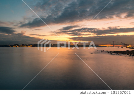 Amazing sunset over the River Tagus in Lisbon, Portugal. 101367061