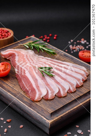 Delicious fresh pancetta with salt and spices cut into thin slices Delicious fresh pancetta with salt and spices cut into thin slices 101367470