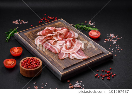 Delicious fresh pancetta with salt and spices cut into thin slices 101367487
