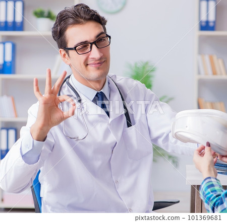 Disabled woman in wheel chair visiting man doctor Disabled woman in wheel chair visiting man doctor 101369681
