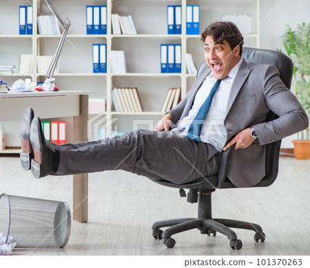 Businessman having fun taking a break in the office at work 101370263