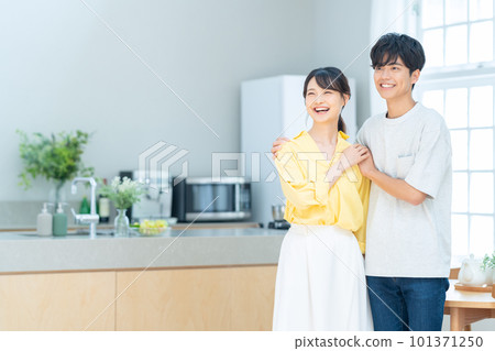 Husband and wife couple family newlywed lifestyle kitchen 101371250