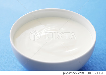 plain yogurt on blue background 101371431