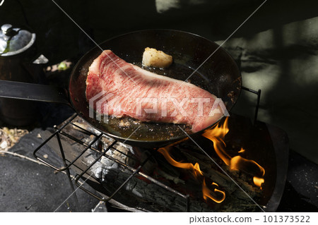 Bake steak at camp 101373522
