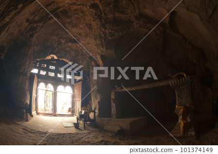 Entrance gate on second floor of Ting Cave or Pak Ou Cave Go inside, there are hundreds of Buddha images. This cave is famous in Luang Prabang Province in Laos. 101374149