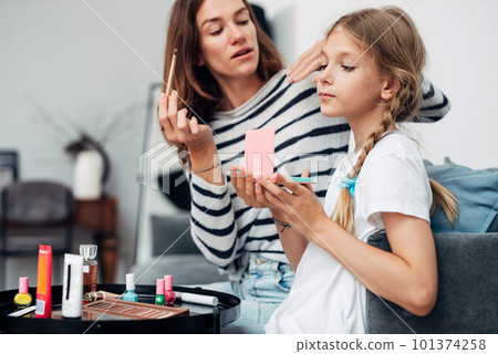 Mother and daughter do a makeover at home Mother and daughter do a makeover at home 101374258
