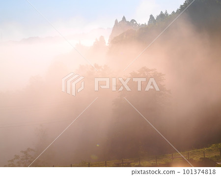 Matsushiro Castle Ruins in Tokamachi City, early morning view of terraced rice fields wrapped in morning fog Matsushiro Castle Ruins in Tokamachi City, early morning view of terraced rice fields wrapped in morning fog 101374818