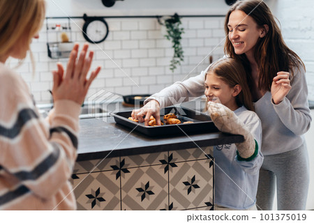 Girl baked cookies her mom and her friend want to try. Girl baked cookies her mom and her friend want to try. 101375019