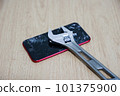 Smartphone destroyed by wrench 101375900