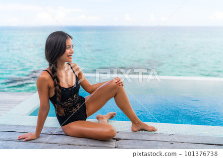 Sexy Asian swimwear black lace lingerie model woman relaxing by infinity pool beautiful body chinese beauty with smooth skin legs. Sexy Asian swimwear black lace lingerie model woman relaxing by infinity pool beautiful body chinese beauty with smooth skin legs. 101376738