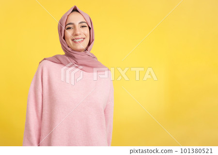 Happy muslim woman smiling at the camera Happy muslim woman smiling at the camera 101380521