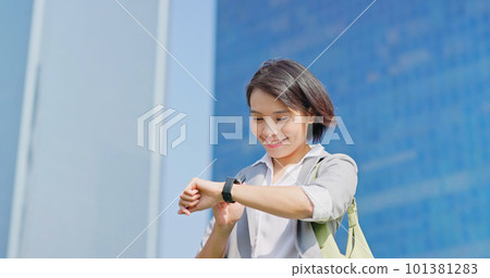 businessfemale look on smart watch businessfemale look on smart watch 101381283