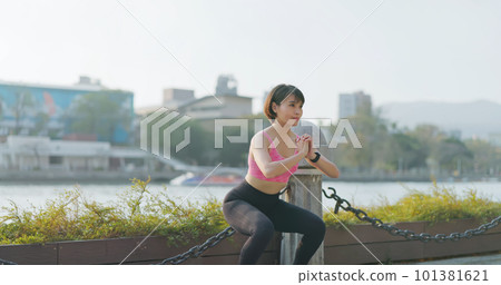 woman doing squat exercise 101381621