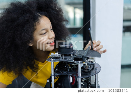 children girl with afro hairstyle education electronic on table at class room. 101383341