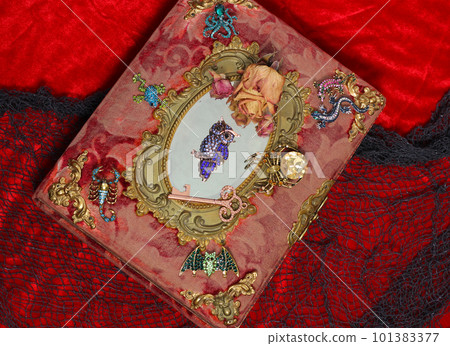 Antique Victorian Era Book With Colorful Gemstones added. Fairy Tale Scary Book With Scorpion and Bat 101383377