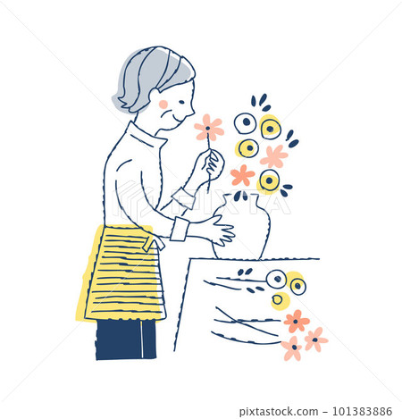 Senior woman arranging flowers in a vase 101383886