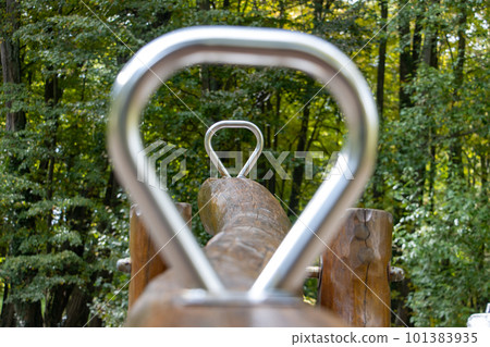 View through the handles of the swing, focused on the back handle 101383935