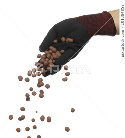 Clay Drainage big size ball pour fall down, explosion in shovel hand. Clay Drainage ball splash in shape form line explosion. White background isolated high speed shutter freeze motion Clay Drainage big size ball pour fall down, explosion in shovel hand. Clay Drainage ball splash in shape form line explosion. White background isolated high speed shutter freeze motion 101384858