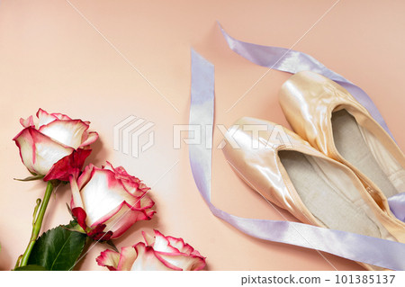 ballet slippers lying on pink background with roses and ribbons. elegant ballet shoes bouquet. beauty dance ballet slippers lying on pink background with roses and ribbons. elegant ballet shoes bouquet. beauty dance 101385137