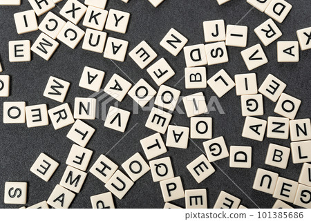 English alphabet made of square white tiles on grey background. English language learning concept. Scrabble game. 101385686