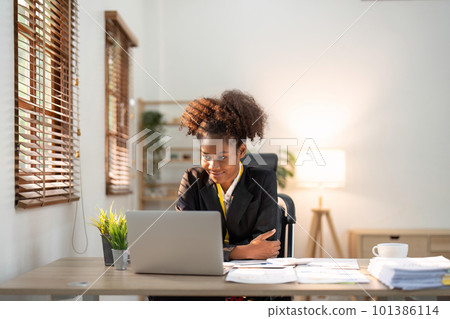 Accountant black woman working on laptop and do document, tax, exchange, accounting and Financial advisor concept 101386114
