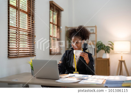 Accountant black woman working on laptop and do document, tax, exchange, accounting and Financial advisor concept 101386115