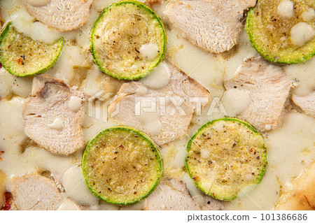 Closeup on chicken pizza with zucchini Closeup on chicken pizza with zucchini 101386686