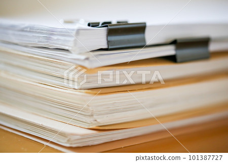 Documents stacked on the desk Paper documents Documents stacked on the desk Paper documents 101387727