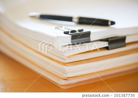Documents stacked on the desk Paper documents Documents stacked on the desk Paper documents 101387730