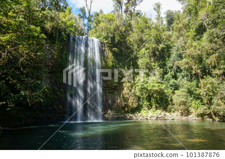 Beautiful waterfall with sunlight and shade Beautiful waterfall with sunlight and shade 101387876