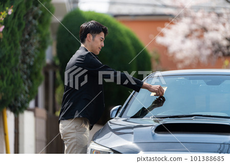 A car with a parking sticker A car with a parking sticker 101388685