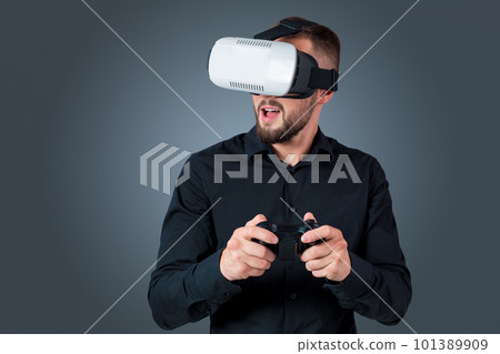 young man using a VR headset glasses 101389909