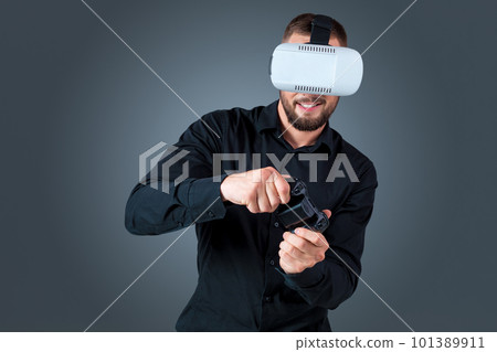 young man using a VR headset glasses 101389911