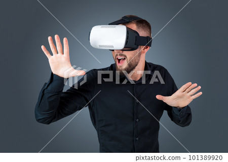 young man using a VR headset glasses 101389920
