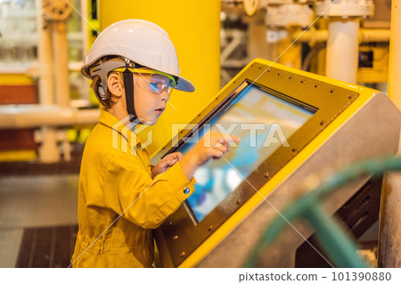 Boy operator recording operation of oil and gas process at oil and rig plant, offshore oil and gas industry, offshore oil and rig in the sea, operator monitor production process, routine daily record Boy operator recording operation of oil and gas process at oil and rig plant, offshore oil and gas industry, offshore oil and rig in the sea, operator monitor production process, routine daily record 101390880