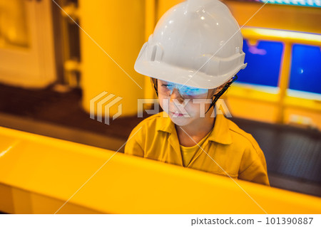 Boy operator recording operation of oil and gas process at oil and rig plant, offshore oil and gas industry, offshore oil and rig in the sea, operator monitor production process, routine daily record Boy operator recording operation of oil and gas process at oil and rig plant, offshore oil and gas industry, offshore oil and rig in the sea, operator monitor production process, routine daily record 101390887