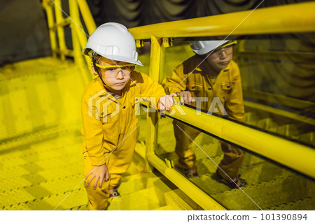 Boy operator recording operation of oil and gas process at oil and rig plant, offshore oil and gas industry, offshore oil and rig in the sea, operator monitor production process, routine daily record 101390894