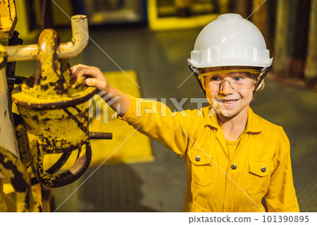 Boy operator recording operation of oil and gas process at oil and rig plant, offshore oil and gas industry, offshore oil and rig in the sea, operator monitor production process, routine daily record 101390895