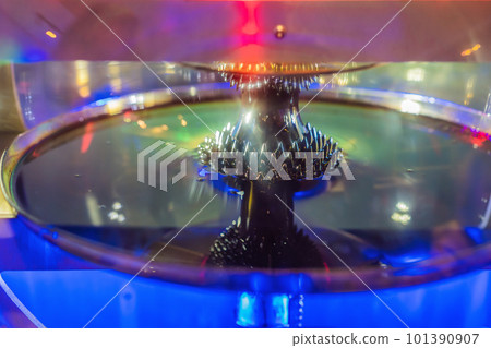 ferromagnetic fluid magnetized by a magnet in a science museum 101390907