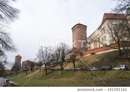 Royal Wawel royal castle in Krakow in rainy early spring weather in Poland. historic castle in the old city Gardens and cathedra, Cracow, Poland. Travel attraction Royal Wawel royal castle in Krakow in rainy early spring weather in Poland. historic castle in the old city Gardens and cathedra, Cracow, Poland. Travel attraction 101391162