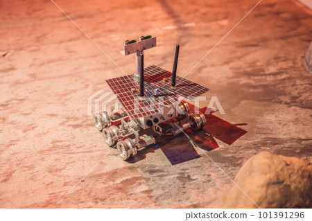 The boy controls the toy rover on Mars. Flight to Mars concept The boy controls the toy rover on Mars. Flight to Mars concept 101391296