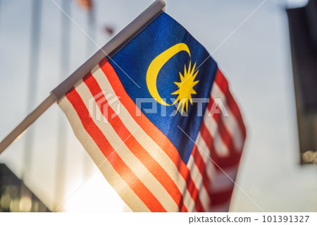 Malaysia flag also known as Jalur Gemilang wave with the blue sky. People fly the flag in conjunction with the Independence Day celebration or Merdeka Day 101391327
